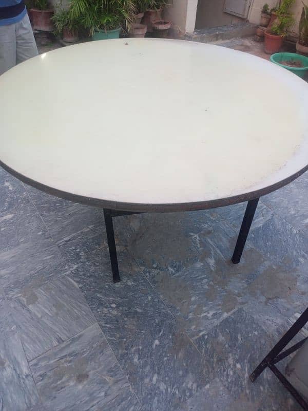 two big wooden tables 24 people sit around it no rust found 4