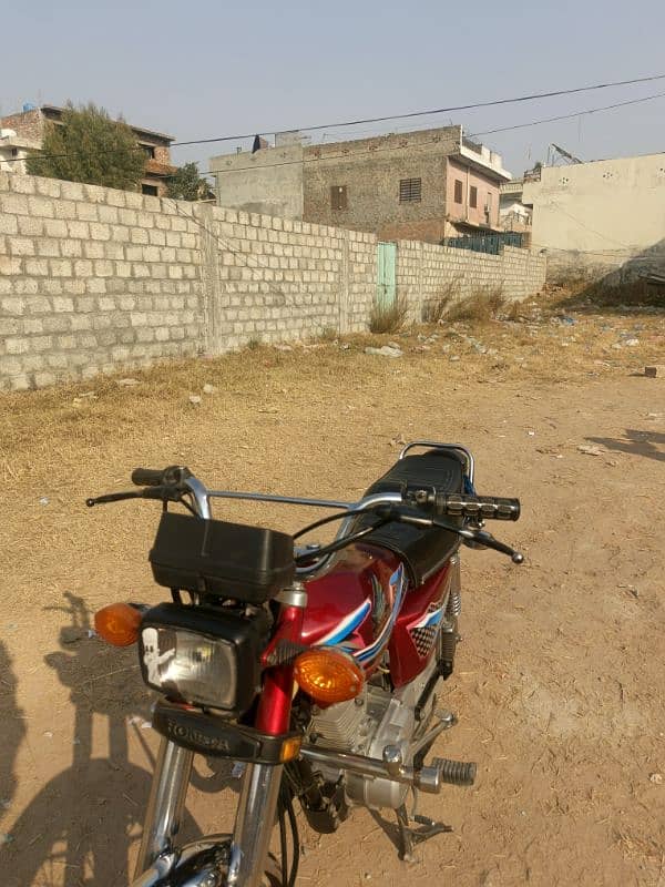 Honda 125  model 2021 Islamabad golden Numbers own my name urgent sale 1