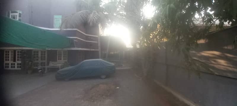 near shahrah e faisal 1500 sq yards with 800 sq yards open plot for parking 1