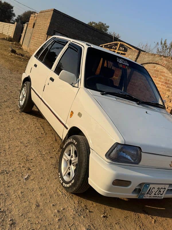 Mehran car 2013 model islambad number ma ha bht achi condition ma ha 1