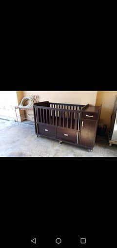 baby cot with mattress.