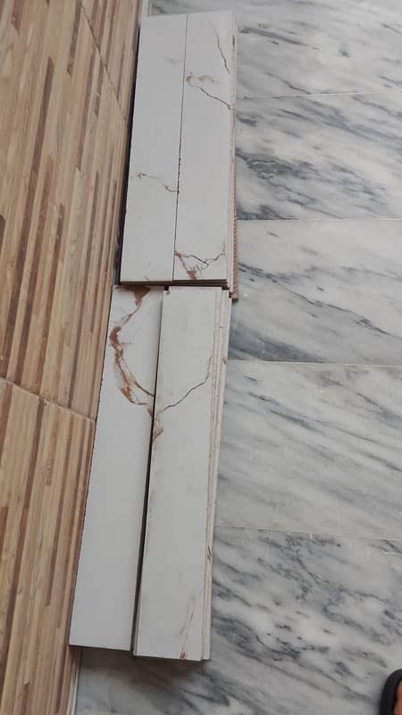 white Color tiles(tile) with golden lines ,border, tile bond 4