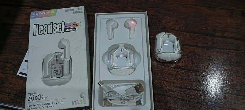 2 earbuds with box 1