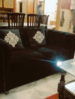 Black velvet sofa in good condition