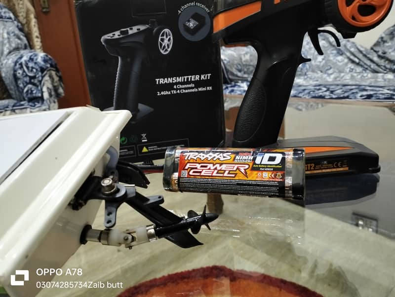 Electric Traxxas boat with battery charger transmitter and receiver 1