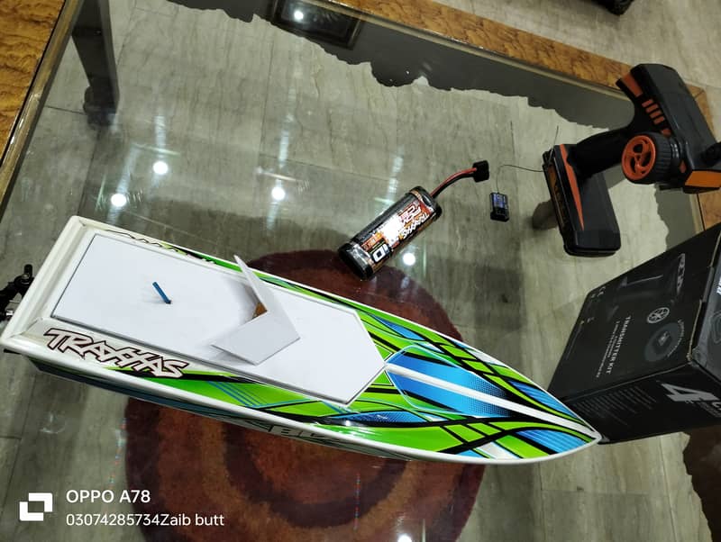 Electric Traxxas boat with battery charger transmitter and receiver 4