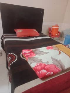 wooden medium sized bed with mattress