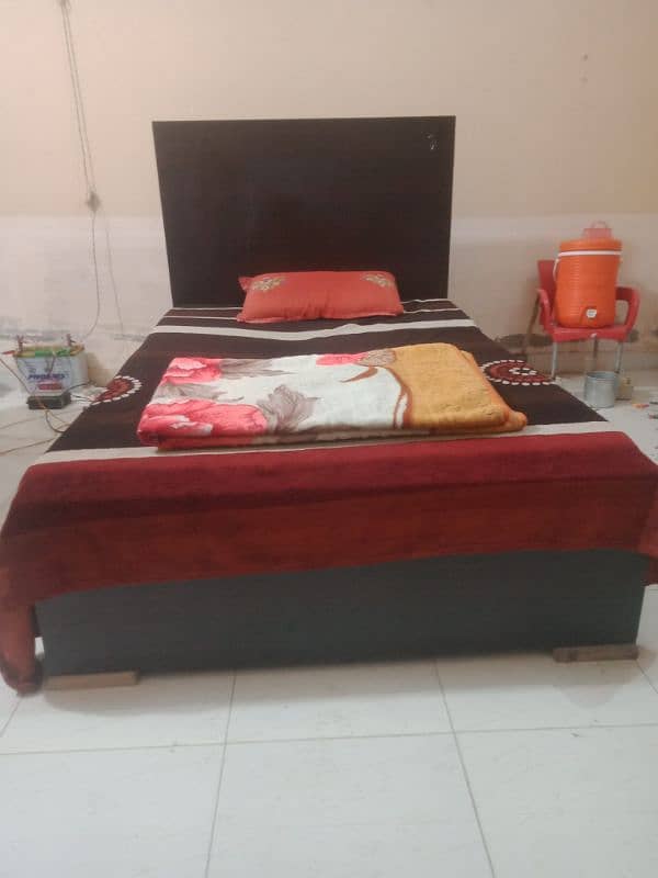 wooden medium sized bed with mattress 1