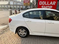 Honda city color white 2015 model. location askari 10