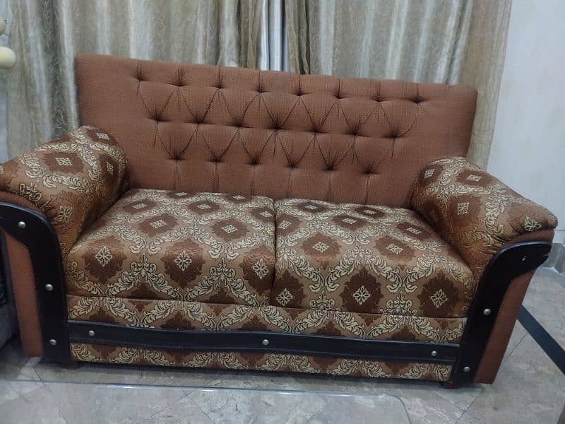 2 seater brown sofa 0