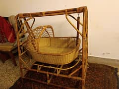 Wooden swinging cradle