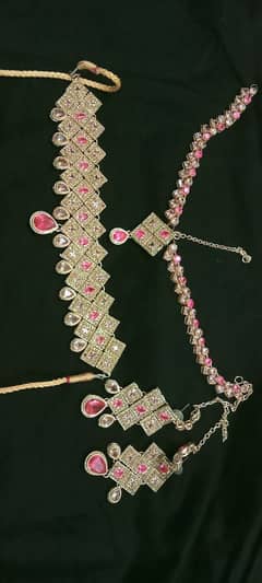 pink and golden jwelry set