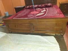 Wooden bed and side tables