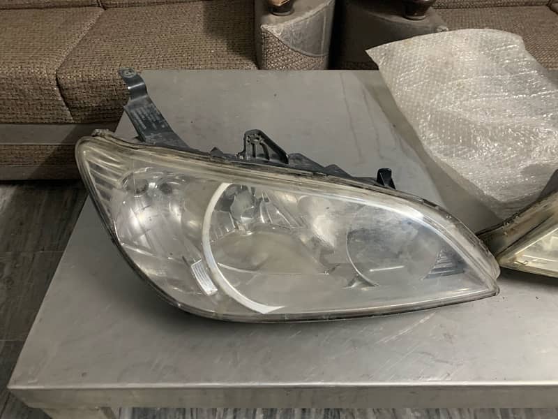 civic 2005 front light back light and left fender 0