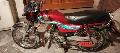 Honda CD-70 red color in all good condition available for sale.