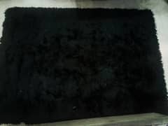 Shaggy black rug