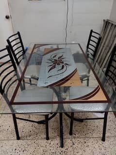 Glass Top Dinning Table with 4 chairs.