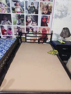 single iron bed with matters