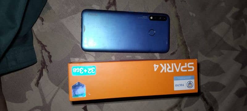 Tecno Spark 4 ha 3 , 32 ha 9