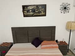 king size bed with side table and mattress