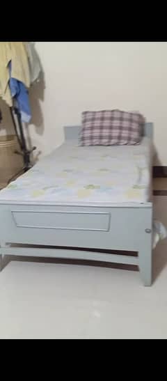 wooden single bed