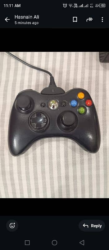 Xbox 360 E with gaming CDS 1