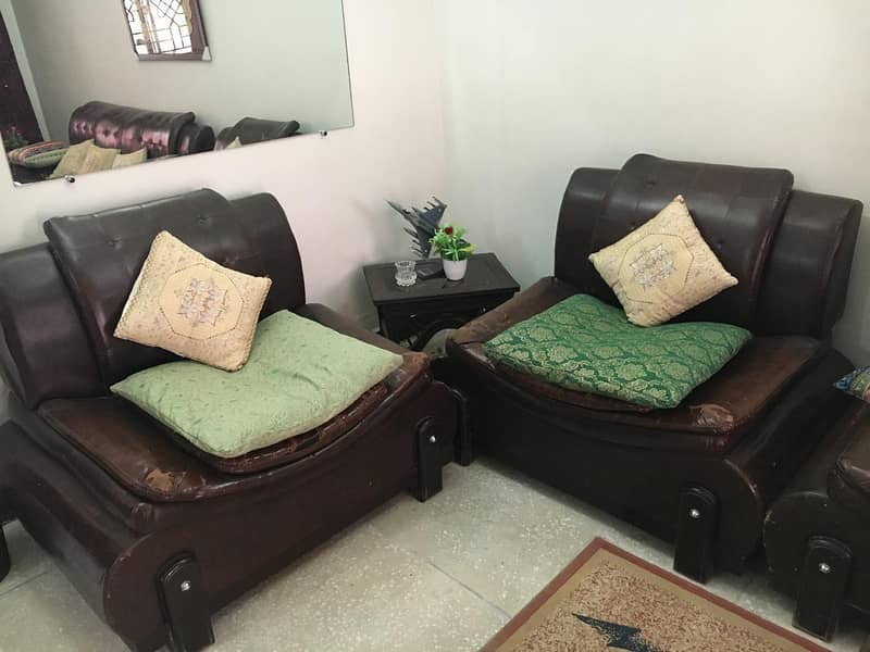 7 seater sofa brown color leather in reasonble condition & Price 1