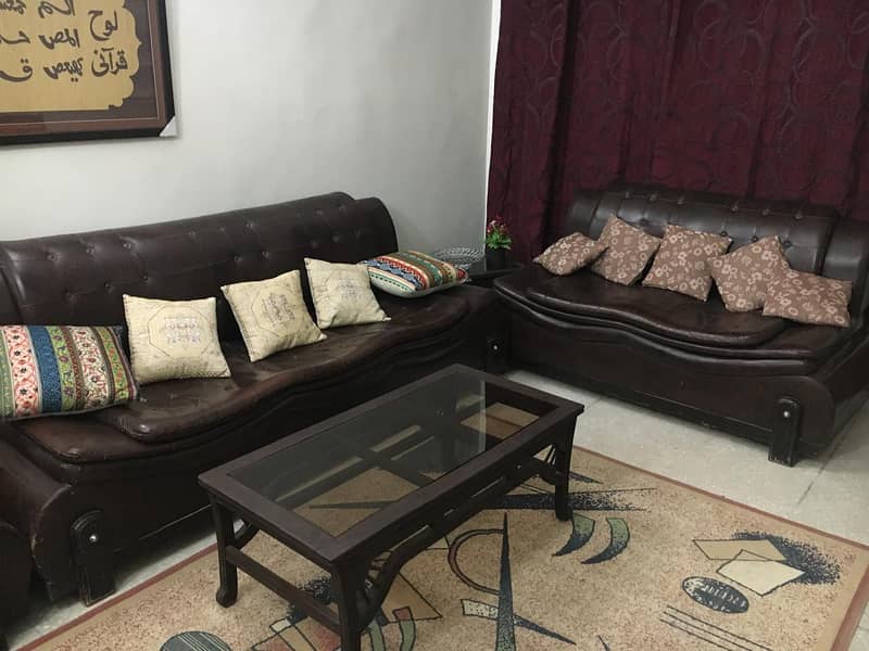 7 seater sofa brown color leather in reasonble condition & Price 2