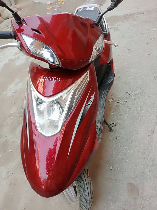 United company sakooty (100cc)red colour 1