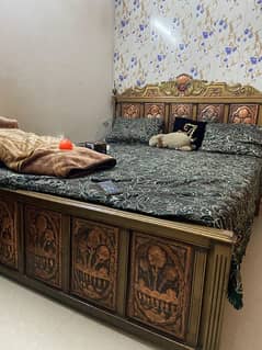 1 stylish wooden and iron bed set with dressing table and side tables.