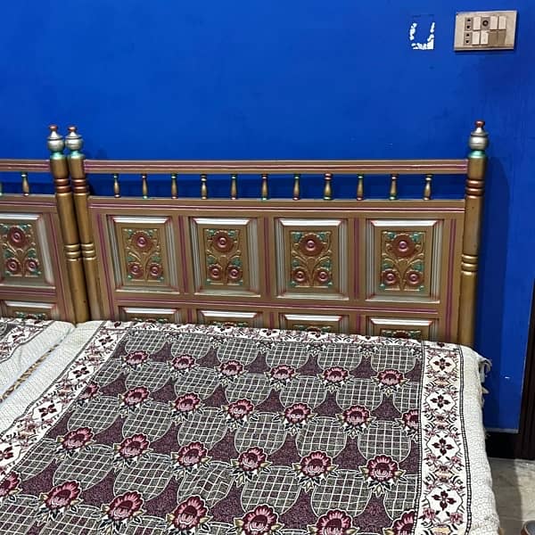 Set of 2 single wooden beds 18000 each 1