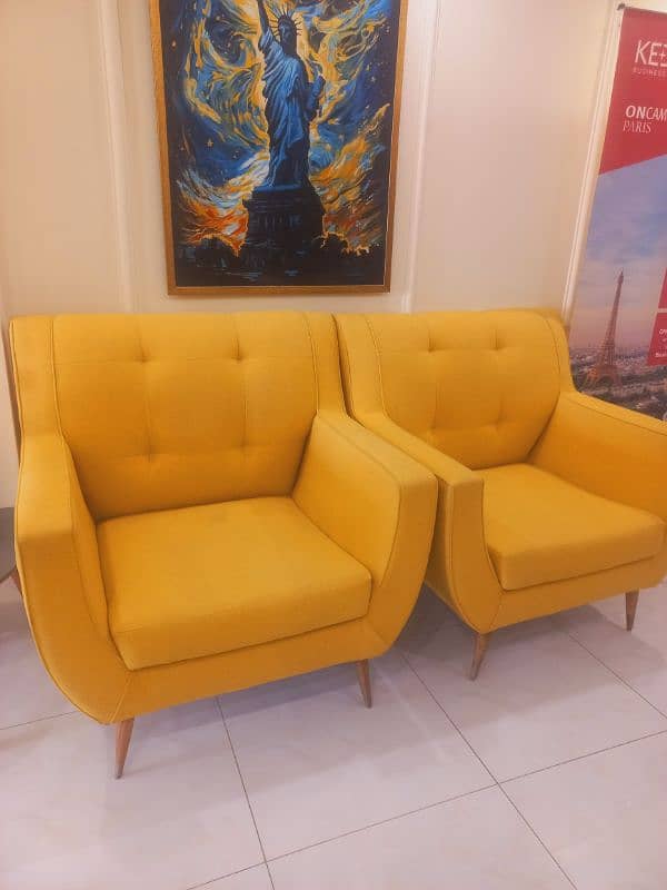 2 yellow colour sofa chair 0