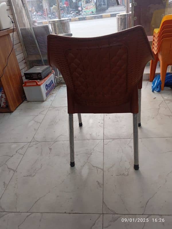 4 plastic chairs with one folding table set 3