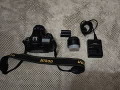 Nikon D7100 with 35-70mm and 50mm 1.8d low ligh lens+battery+charger.