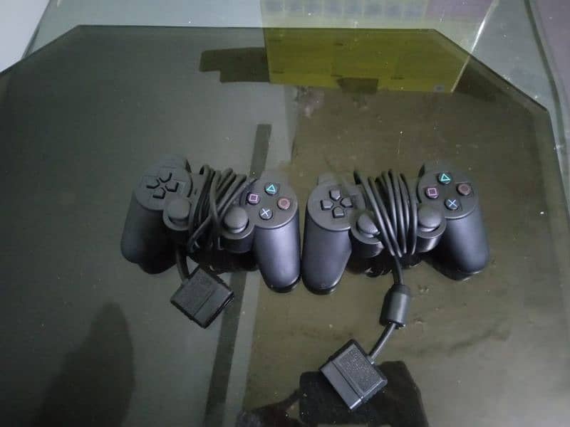 PS2 with box and 2 controllers and 40+ games + hdmi converter 0