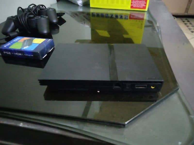 PS2 with box and 2 controllers and 40+ games + hdmi converter 2