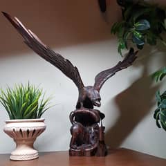 Antique large eagle with lion standing in base 2 feet by 1.5 feet