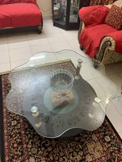 Beautiful Glass centre table with wooden base.