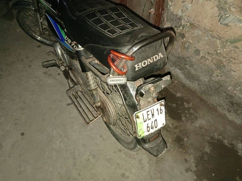 united CD 70 bike black colour lahore number good condition 1