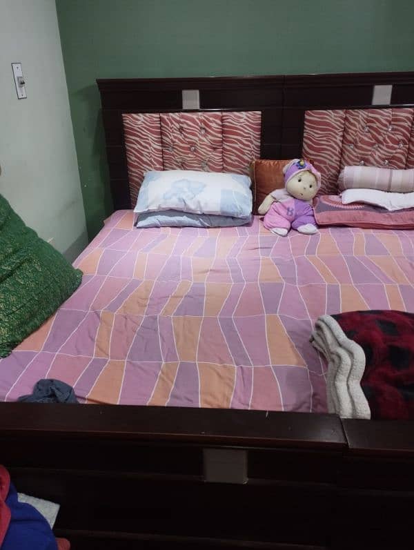 2 single beds with side table and mattress 1