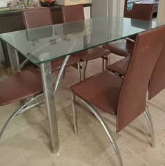 metal frame with glass top dining table