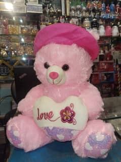 medium size teddy bear with pink and red colour