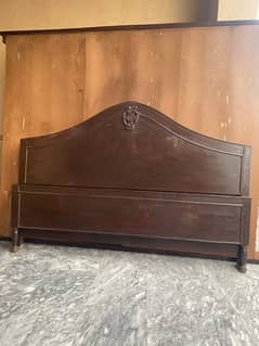 Old used bed and dressing and mirror