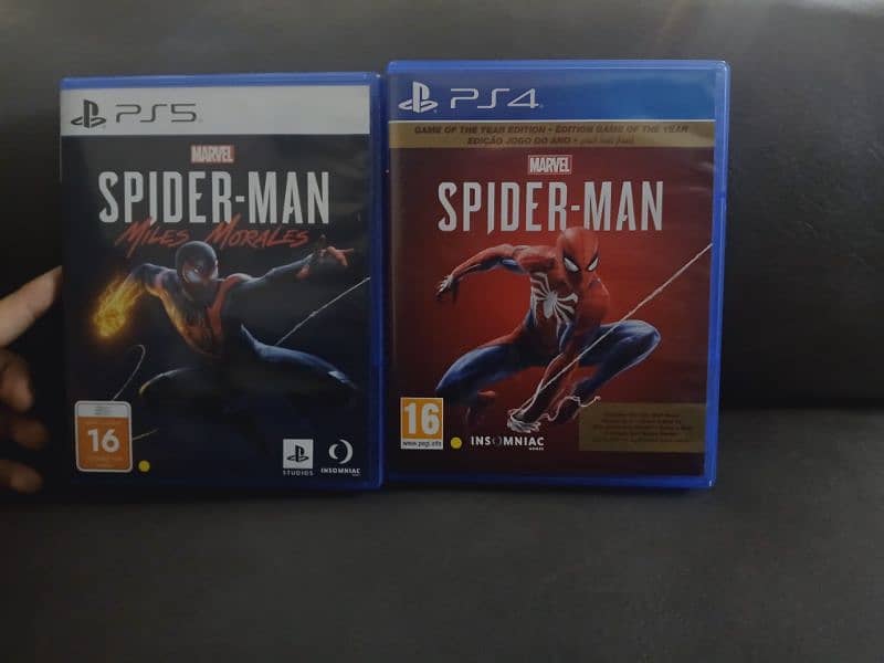 Spiderman 2018 ps4 [UAE version] used and spiderman miles morales ps5 0