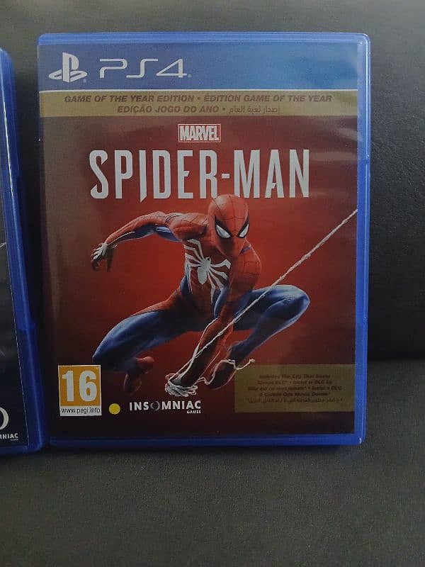 Spiderman 2018 ps4 [UAE version] used and spiderman miles morales ps5 1