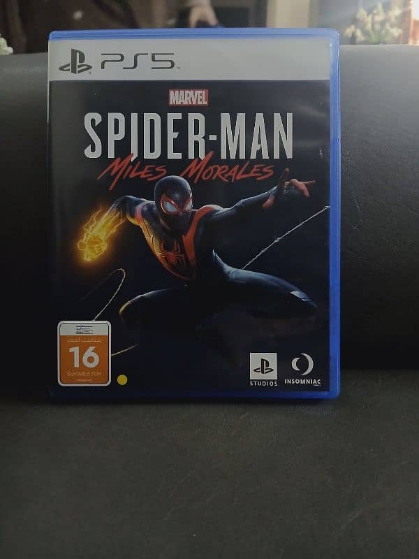 Spiderman 2018 ps4 [UAE version] used and spiderman miles morales ps5 4