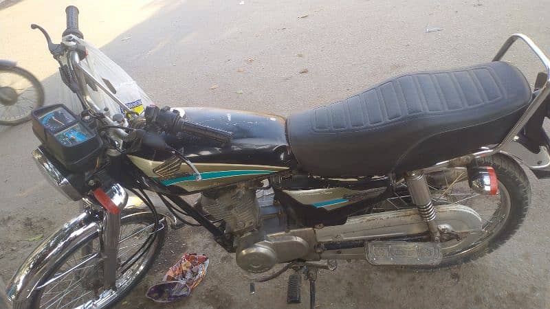 Honda CG 125 Faisalabad number hai 0