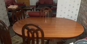 Wooden dining table with six chairs