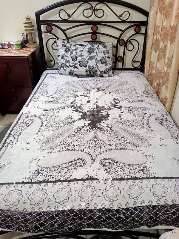 single iron bed with mattress and iron stand 0