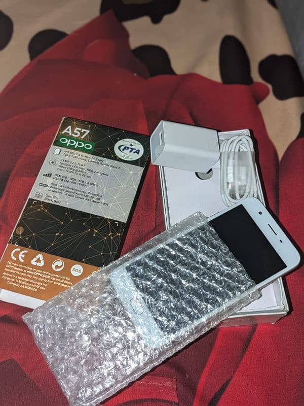 Oppo A57 new phone box and charger be ha 0